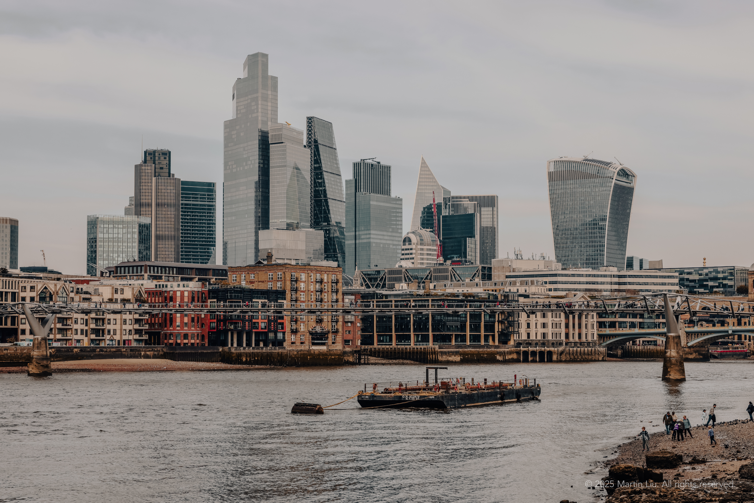 View of London Shard and surrounding skyscrapers along the Thames River